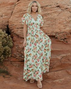 Our Lynlee Metallic Maxi Dress is the epitome of feminine charm🌸 With a deep V-neck that flatters, dainty flutter sleeves, and the cutest floral print, she is the perfect blend of style and grace!✨ Plus, she's totally bump-friendly!😉 Don't miss out on this must-have piece – shop now🛍️ Summer V-neck Maxi Dress With Elastic Waistband, Pink V-neck Dress With Elastic Waistband, V-neck Chiffon Maxi Dress With Print, Printed Chiffon V-neck Maxi Dress, Green V-neck Maxi Dress With Smocked Back, Flowy Floral Print Maxi Dress With Empire Waist, Flutter Sleeve Dresses With Smocked Back For Garden Party, Vacation Maxi Dress With Ruffle Sleeves, Feminine Flowy Printed Maxi Dress