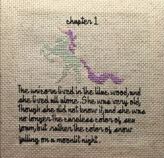 a cross stitch pattern with words written in black and purple on the bottom, along with an image of a dragon