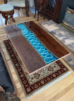 a living room with wood floors and rugs on the floor