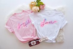 two t - shirts that say bride and groom on them next to a bottle of booze