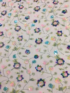 We offer a variety of fashion handmade fabric，those are widely use for wedding dress，garment and fashion cloth. we sell it by yard，our minimum order is 1 yards，and we always package it 15 yards for one roll，the width is about 125cm /48inch Material ： sequins ,mesh ,Rayon,polyester. Symmetrical embroidery floral pattern, with lovely flowers in the middle, scalloped border. You can also cut and use separately. Perfect for dress, tops, wedding veil. You can split the piece up and have one scalloped Silver Sequin Fabric With Floral Embroidery For Wedding, Party Sequin Fabric With Floral Lace Applique, Sequence Fabric, Pink Lace Sequin Fabric With Pearl Embroidery, Embroidered Multicolor Lace Sequin Fabric, Elegant Pink Sequin Fabric With Floral Embroidery, Wine Colored Wedding, Flower Lace Fabric, Multicolor Sequins