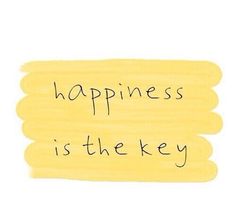 the words happiness is the key are written in black ink on a yellow piece of paper