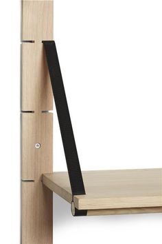 a wooden shelf with a black handle on it