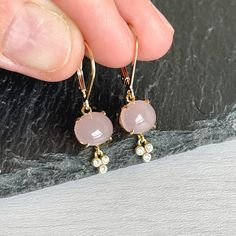 Rose Quartz Earrings, Oval Blush Pink Earrings, Dainty Dangle Drops, Tiny Everyday Gold Drops, Unconditional Love, Valentine's Day Gift These darling small earrings feature oval smooth rose quartz stones prong set in gold filled. Suspended from the pink gemstones are delicate gold filled dangle elements with 3 white topaz stones that add great sparkly but hardly any length. These earrings are minimal, understated and neutral, also very feminine and delicate About These Earrings - Gemstone: Rose Feminine Hypoallergenic Dangle Earrings, Feminine Dangle Earrings For Anniversary, Blush Pink Earrings, Rose Quartz Earrings, Earrings Gemstone, Rose Quartz Stone, Earrings Dainty, Pink Gemstones, Topaz Stone