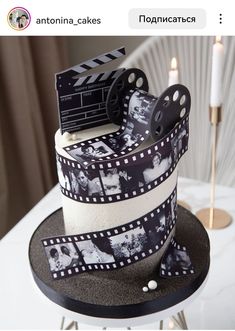 a cake that is decorated with film reels