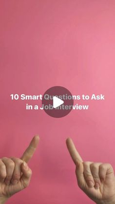 two hands with the words 10 smart questions to ask in a job interview on pink background