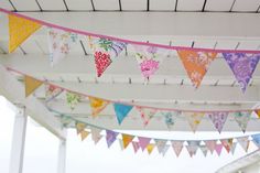 colorful bunting hanging from the roof of a building