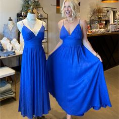 Our Cobalt Blue With Gold Thread Maxi Dress Features Cami Top, Waist Yoke, Full Skirt, Smocked Back Waist Band With Tie Detail Details Self : 100% Rayon Lining : 100% Polyester Size & Fit - Model Is 5`8" And Wearing Size Small - Measurements Taken From Size Small - Approx. Length: 51.5" Blue A-line Maxi Dress For Date Night, Blue Sundress Maxi Dress For Parties, Blue Lined Maxi Dress, Royal Blue Spring Maxi Dress, Spring Royal Blue Maxi Dress, Blue Sundress Midi Dress For Party, Blue Ruched Maxi Dress For Summer, Blue Summer Maxi Dress For Evening, Blue Sundress For Party