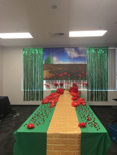 a long table with red flowers on it