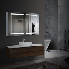 a bathroom with a sink, mirror and shower in it's center wall area