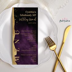 a white plate topped with a purple and gold dinner menu next to a golden fork