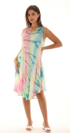 "Feel the summer breeze in this flowing sleeveless sundress featuring an adorable ombre multicolored tie-dye design, an embroidered scoop neckline, and a curved hem for a dash of extra flair. This lightweight and relaxed fit dress are perfect for comfortable wear. It can be used as a beach cover-up. Features: * Tie-Dye pattern in vivid colors *  Embroidery on the neck * Flattering scoop neckline * Sleeveless * A-line silhouette * Unlined * Loose and Comfort fit * Curved Hem with extra flair * On Summer Tie-dye Sundress For Vacation, Sleeveless Tie-dye Dresses For Beach Season, Casual Tie-dye Sleeveless Sundress, Sleeveless Cotton Tie-dye Dresses, Sleeveless Tie-dye Maxi Dress For Spring, Boho Chique, Tie Dye Designs, Tie Dye Patterns, Boho Casual