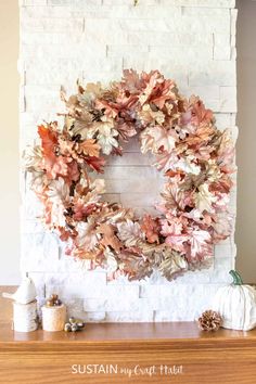 a white brick wall with a wreath on top of it and other decorations around it