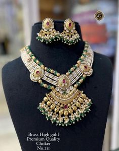 Description :- Antique Gold Plated Indian Jewelry Set, Indian Choker, White Pearl Ruby Necklace, Guttapusalu Necklace, Temple Jewelry, South Indian Jewelry Gift yourself a royal look with this perfectly crafted kundan necklace set from Manalisstudio. Crafted with high quality kundan stones and pearls, it is impressive in design. The green enamel artwork adds perfect texture to the design. Perfect for weddings and festivities, this antique necklace set should be put on with your favorite sari or Guttapusalu Necklace, Indian Jewelry Set, Indian Choker, Temple Jewelry, South Indian Jewelry, Indian Jewelry Sets, Kundan Necklace, Ruby Necklace, Kundan Necklaces