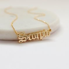 Beautiful and lovely Zodiac sign necklace made of gold plated Scorpio scrip pendent with skinny gold chain. Soft and warm and great for gift items.  Your necklace will ship in a gift box. If you have any questions, please feel free to contact me. Thanks :)    * Chain length 14" - 20"  * Pendant 3/8" x 1 1/4"  * Gold plated brass  * Zodiac Jewelry Birthday Jewelry Astrology Zodiac necklace  Scorpio  (Oct 23 - Nov 21)  * Delivery Time Fast shipping within 1 - 3 days  * See more Rudiana Accessories + www.Rudiana.etsy.com Gold Zodiac Sign Necklaces For Birthday, Gold Zodiac Sign Necklaces For Birthdays, Zodiac Necklace Scorpio, Scorpio Necklace, November Birthday Gifts, Script Necklace, Zodiac Sign Necklace, November Birthday, Birthday Jewelry