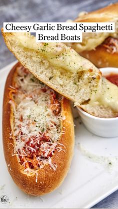 cheesy garlic bread spaghetti and bread boats on a white plate with text overlay