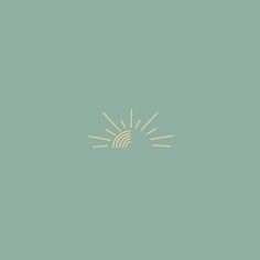 the sun shines brightly in front of a green background with gold lines on it