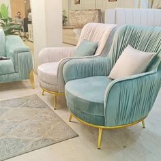 a living room filled with blue and white furniture