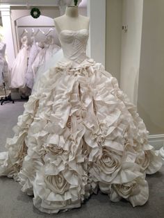 a wedding dress on display in a store