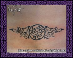 a tattoo design on the back of a woman's stomach, with celtic designs