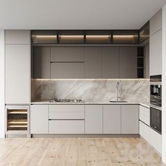 an empty kitchen with wooden floors and white cabinets