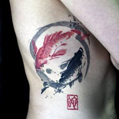 a man with a tattoo on his stomach has two koi fish in a circle