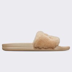 One of our most requested collections is back just in time for the holidays. Our APL Shearling Slide features a soft, cozy strap and lining accented by a striking embroidered APL logo. Your feet will thank you every time you slip them on. The full-length shearling footbed covers a 3D molded footbed that massages your feet with every step. Our proprietary midsole/outsole uses our tried and true Propelium ® compound offering the same great cushioning and rebound from the running shoes you love. Wh Ootd Overall, Airport Shoes, Fuzzy Slides, Shearling Vest, Wide Leg Sweatpants, Mens Slides, Chunky Knit Cardigan, Womens Slides, Tried And True