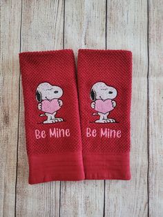 two red towels with snoopy dogs on them that say be mine and have hearts