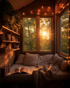 the sun is shining through the window in this room with a bed and bookshelf