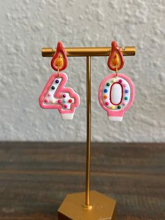 Celebrate your birthday in style with these unique handmade birthday candle earrings. Each pair is custom-made so you can personalize your earrings based on your age. Perfect for a special occasion or as a thoughtful gift. White with a delicate pink finish. Candle Earrings, Number Candles Birthday, Earring Inspo, Number Candle, Arte Alien, Hand Painted Earrings, Elegant Birthday, Modern Tattoos, Painted Earrings