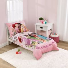 The Disney Princesses share the magic of friendship in this 4 piece toddler bed set! Featuring Ariel, Tiana, Moana, Jasmine, and Cinderella on a soft pink background, surrounded by flowers in shades of pink, green, turquoise and white. The 4-piece set includes a 42" x 57" printed comforter, fitted sheet with fully elasticized edges, flat top sheet, and a reversible pillowcase. Sheets have an allover print design, featuring the Princesses and flowers, all on a crisp white background. Fit a standa Princess Toddler Bed, Toddler Bed Girl, Disney Princess Toddler, The Disney Princesses, Toddler Sheets, Toddler Bed Set, Toddler Pillow, Toddler Mattress, Shaped Pillow