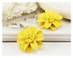 Handmade Yellow Dahlia dangle earrings or drop earrings. Available in several yellow shades. Each petal is formed by hand and drops from a selection of earwire options. Choose from assorted kidney or leverback earwires or titanium (hypoallergenic) short hooks. -Original hand sculpted polymer clay flowers -Durable, water-resistant -No molds, no paint, no glue -Assorted earwires to choose from -Titanium (hypoallergenic) option available -Flower size : 1.5cm -Lightweight earrings View matching coll Elegant Yellow Dangle Flower Earrings, Yellow Hypoallergenic Flower-shaped Earrings, Yellow Flower Drop Earrings With Ear Wire, Yellow Earrings With Flower Charm For Gift, Yellow Flower Charm Earrings As Gift, Yellow Hypoallergenic Flower Drop Earrings, Hypoallergenic Yellow Flower Drop Earrings, Hypoallergenic Yellow Drop Flower Earrings, Yellow Dangle Flower Earrings As Gift