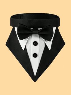 a black and white tuxedo with a bow tie on it's chest