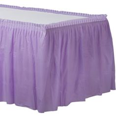 a purple bed skirt with pleated edges