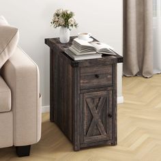 a wooden table with a book on it next to a chair