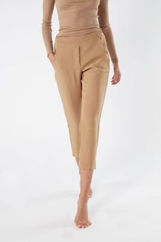 Full-length trousers featuring two pockets, faux back pocket and covered elasticated waist. Bottoms With Elastic Waistband And Straight Hem For Fall, Business Casual Bottoms With Pockets, Spring Dress Pants With Side Pockets For Work, Tapered Leg Bottoms With Pockets For Business Casual, Relaxed Fit Dress Pants With Side Pockets, Business Casual Bottoms With Tapered Leg And Pockets, Solid Tapered Leg Pants With Elastic Waistband, Business Casual Tapered Leg Bottoms With Pockets, Solid Color Tapered Leg Pants With Elastic Waistband