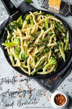 pasta with asparagus and broccoli in a skillet on a table