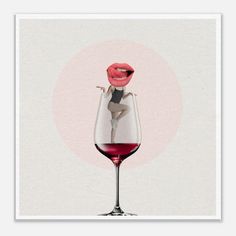 a woman sticking her tongue out in a wine glass with red liquid on the bottom