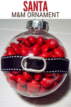 a glass ornament filled with red candies