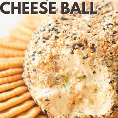 a cheese ball with crackers on the side