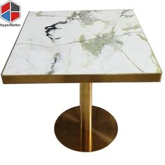 a white and gold table with a marble top