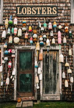 an old building with lots of lobsters hanging on it