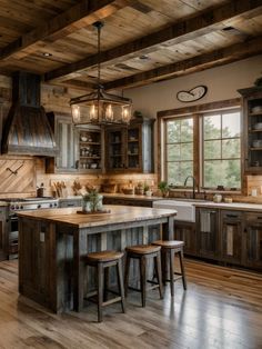 a large kitchen with wooden floors and lots of counter top space, including an island