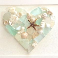 a heart made out of sea glass with a starfish