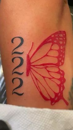 a butterfly tattoo with the word love on it