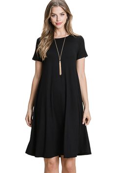 Give your closet a comfy update with this Solid Knee Length Dress. This comfortable dress made from soft, stretchy fabric is sure to become a favorite dress. Styled with a simple crewneck and a knee length cut, it's ideal to wear for casual outings. Pair this dress with slip-on flats, casual sneaks or wedge heel sandals to create your own unique personal aesthetic. 95% Rayon 5% Spandex Dress features crew neckline, short sleeves, trapeze silhouette, pullover style, stretchy fabric and knee lengt Simple Crewneck, Style Black Dress, Shift Dresses, Womens Shift Dresses, Spandex Dress, Black Short Dress, Crewneck Dress, Vestido Casual, Midi Dress With Sleeves