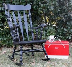 an old rocking chair is painted black and red with the words rocking chair makeover on it