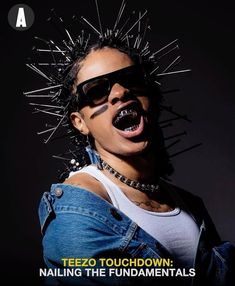 a woman with spiked hair and sunglasses on her face is posing for a magazine cover