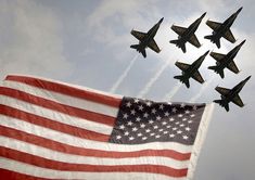 an american flag with jets flying in the sky above it and on top of one another