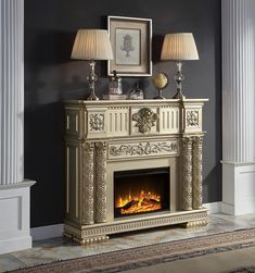 an ornate fireplace with two lamps on top